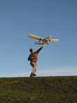 SX22360 Richard with RC plane lifting off.jpg